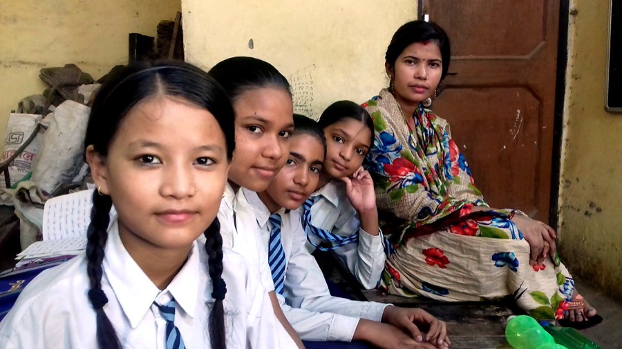 Students and a teacher together in a classroom
